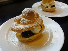 Fresh baked little cream puffs with cherries await guests at Vanilla Hills Lodge, Cayo, Belize – Best Places In The World To Retire – International Living